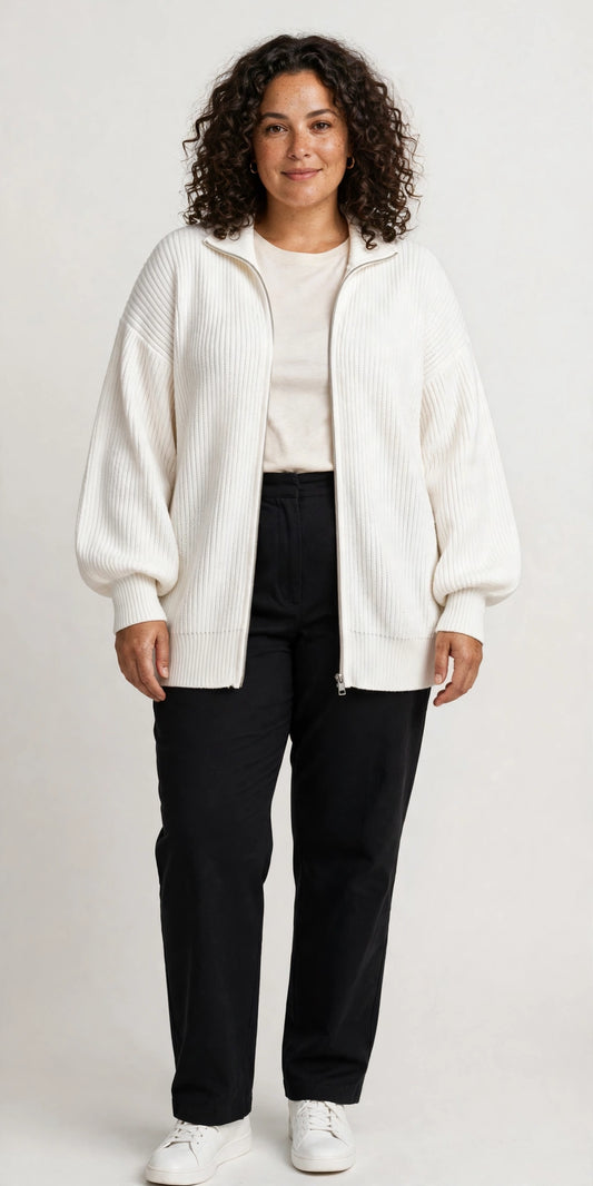Plus-size model wearing the ribbed knit zip-up cardigan with lantern sleeves